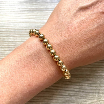 Bracelet grosses perles dorées