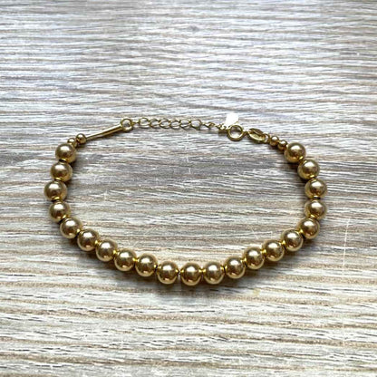 Bracelet grosses perles dorées
